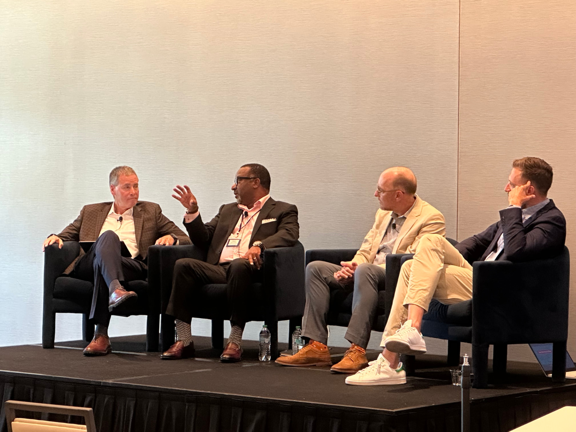 Panel discussion on stage at a FIN Forum event