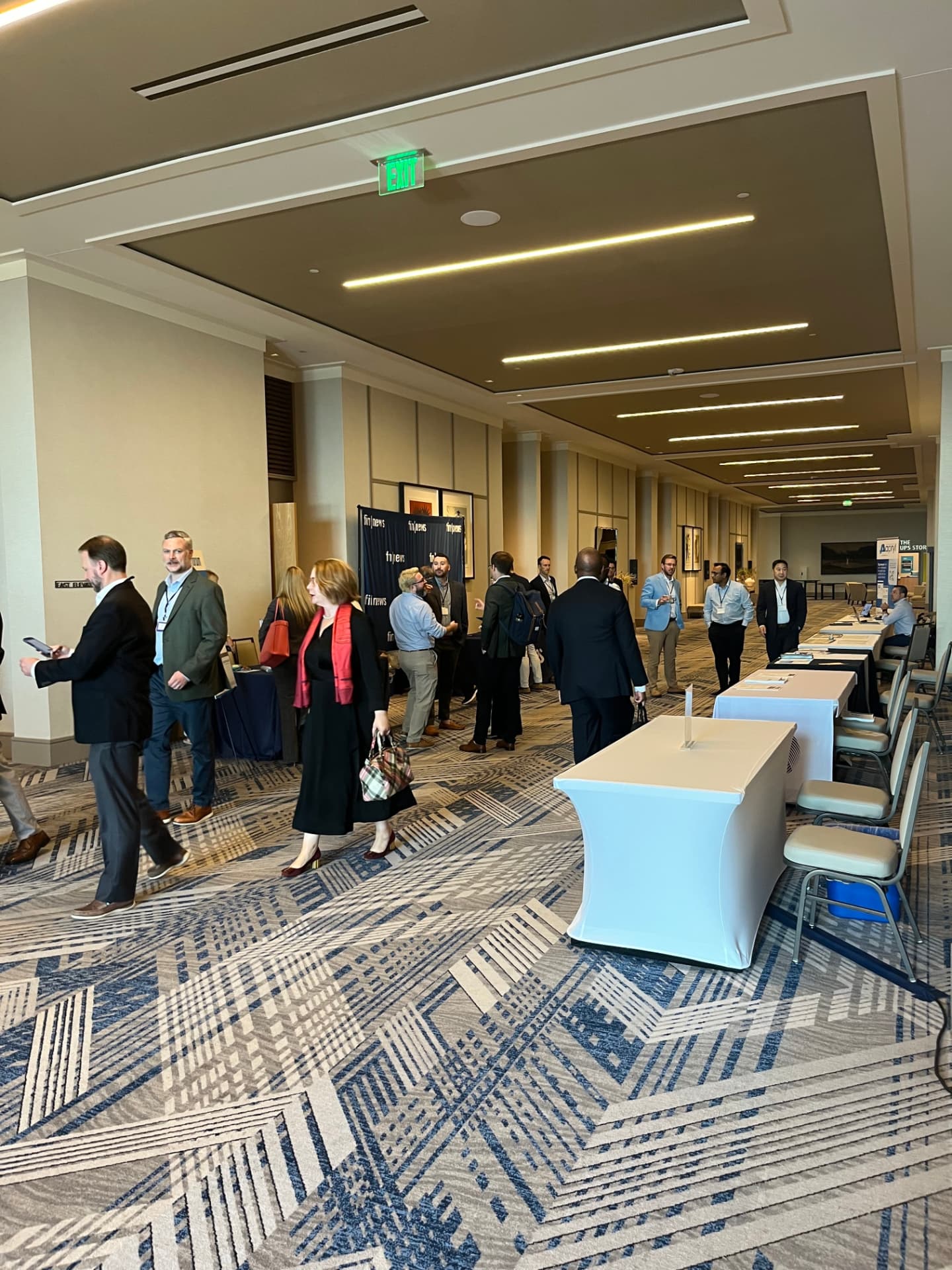 Attendees networking in the FIN Forum registration hall
