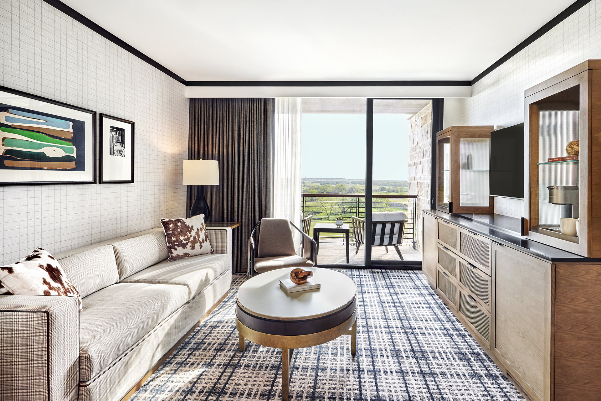 Guest suite with balcony overlooking the fairways at Omni PGA Frisco Resort